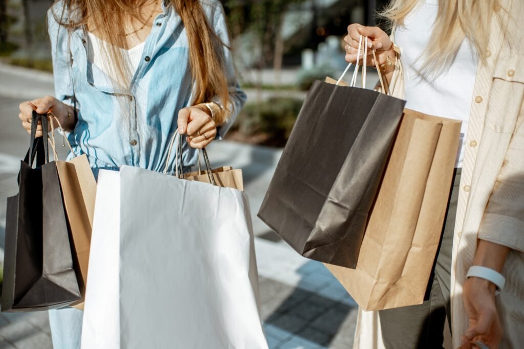 Women with shopping bags near the mall outdoors