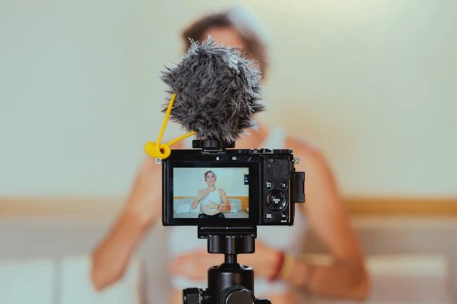 Person recording short-form video on a tripod